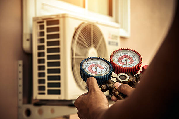 Professional Heat Pump Repair technician working in Manlius, NY